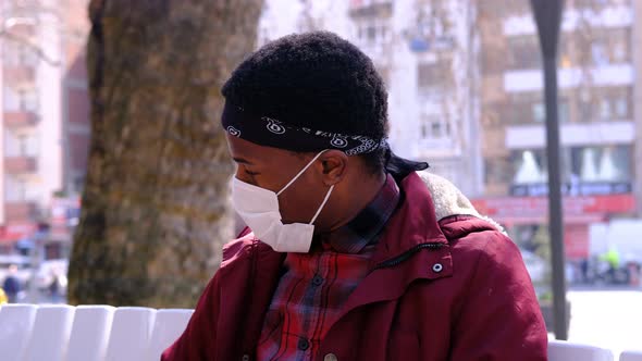 Black Man Wears His Masked Glasses alt