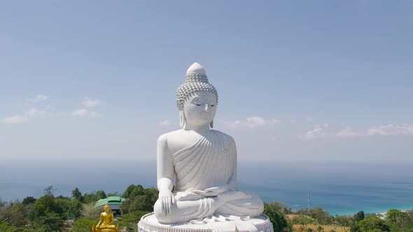 White Buddha Statue in Thailand Standing on the Top of Mountain