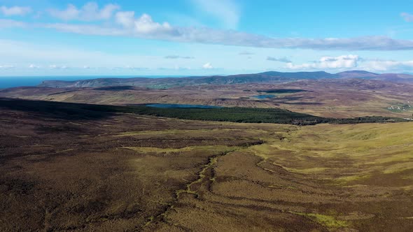 Aerial View of the Beautiful Coast at Malin Beg with Slieve League in the Background in County alt