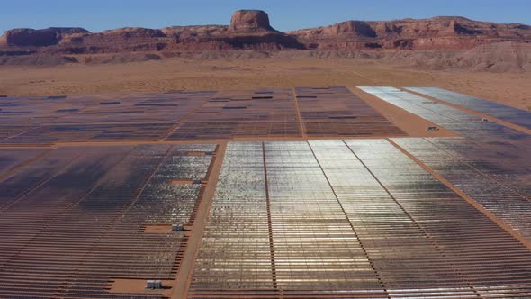 Aerial view moving over a large Solar Plant in the middle of the desert, Kayenta Arizona alt