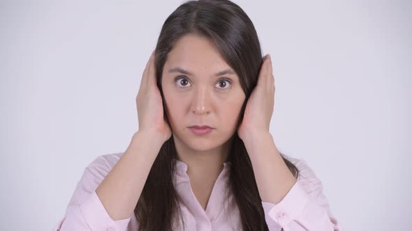 Face of Young Multiethnic Businesswoman Covering Ears As Three Wise Monkeys Concept alt