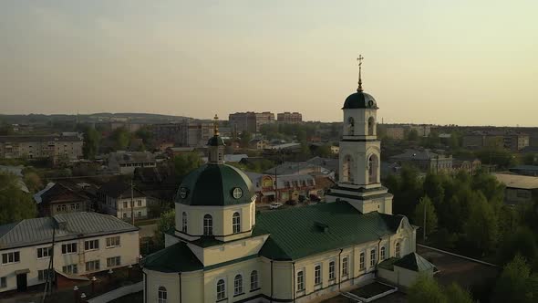 Old Church Surrounded By Residential Buildings in Small Town