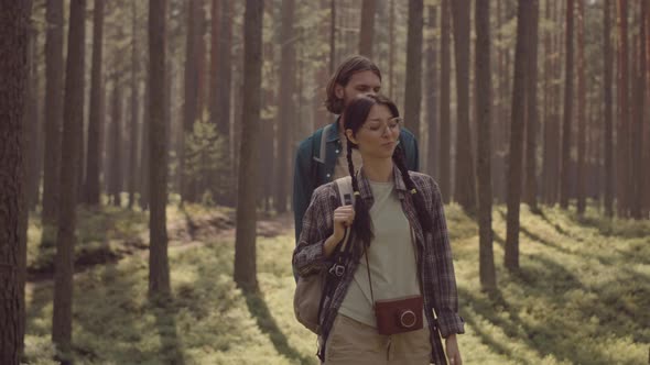 Diverse Friends Walking in Forest alt