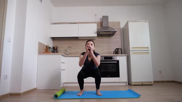 Energetic Girl Performs Exercise to Strengthen Leg Muscles and Buttocks Squats
