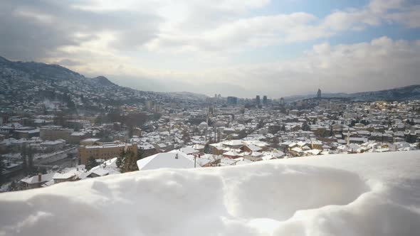 Overview of a snow-filled rooftops of a neighborhood in Sarajevo alt
