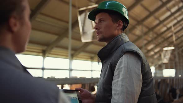 Livestock Workers Talking Cowshed Discussing Diagram alt