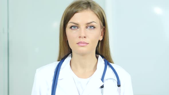 Portrait of Female Doctor Looking At Camera in Clinic alt
