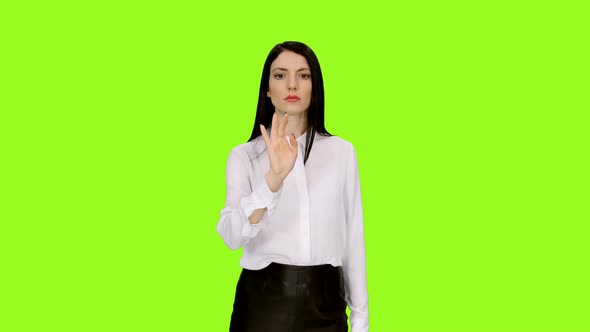 Attractive Businesswoman Makes Different Hand Gestures Through a Virtual Display