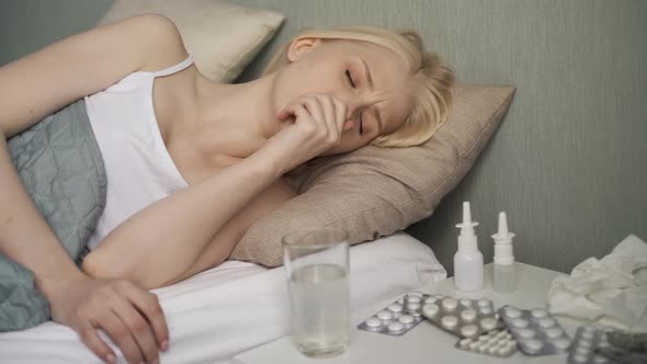Young Ill Woman in Bed at Home alt