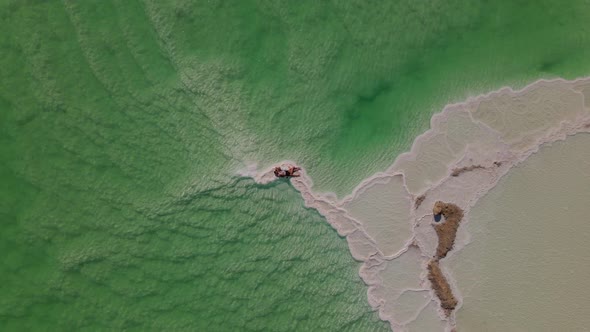 Loving Couple is Resting on the Dead Sea