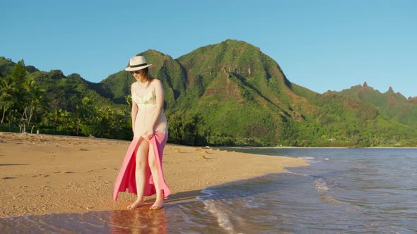 Woman in Pink Dress Walking By Beach Touristic Landmark Nature Park Destination alt