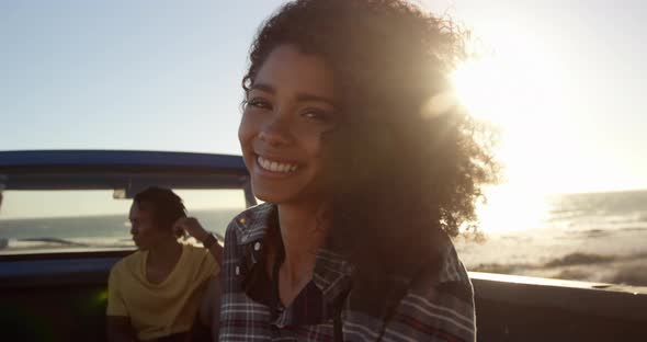 Woman standing near pickup truck on the beach 4k alt