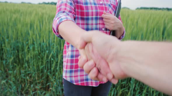 First-person View Handshake of Two Farmers alt