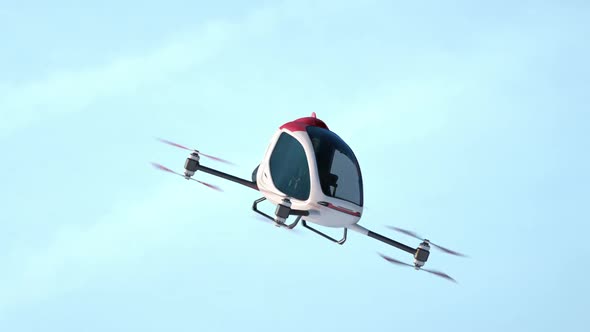 Electric Passenger Drone flying above buildings