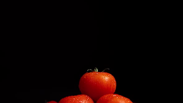 Washing the Pile of Fresh Tomatoes