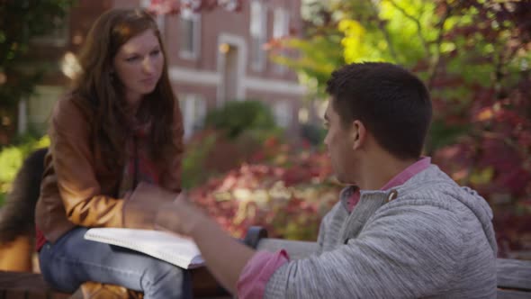 College students on campus meet in courtyard