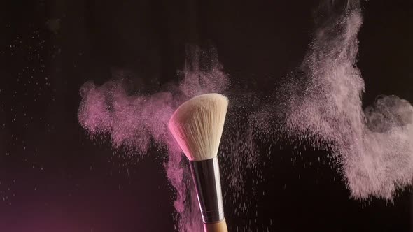 Close Up Selective Focus Shot of Shimmer Powder Being Shaken Off Makeup Brush Slow Motion