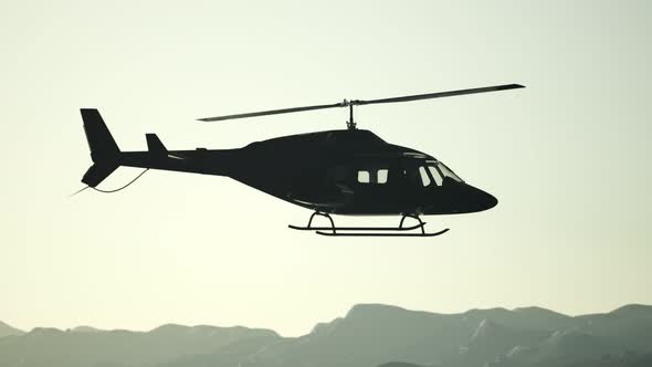 Extreme Slow Motion Flying Helicopter and Sunset Sky alt