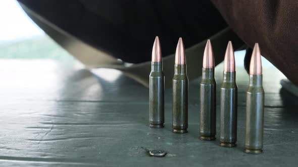 The Cartridges Are in a Row on the Table Prepared for Firing a Firearm