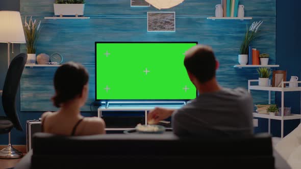 Caucasian Individuals Using Television for Green Screen alt