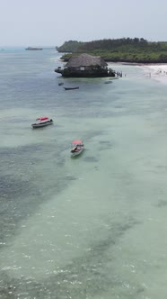 Tanzania  Vertical Video House on Stilts in the Ocean on the Coast of Zanzibar Slow Motion alt
