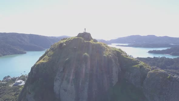 Silhouette of man on top of mountain