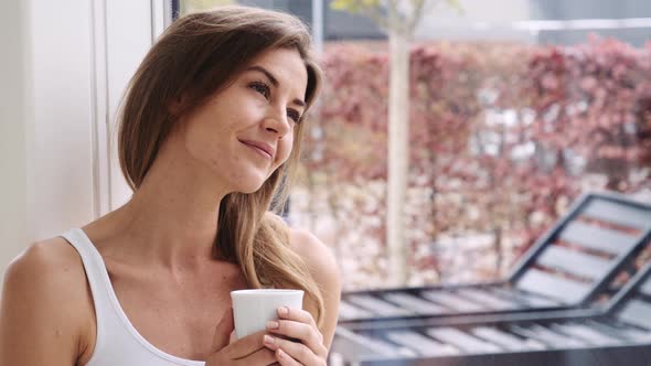 Woman Enjoying Morning Coffee