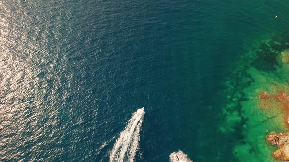 Drone Over Boats In Sea Just Off Coastline Of Cap De Creus alt