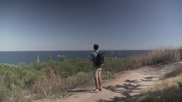 Caucasian Male Tourist Delighting Sea View in Sunny Summer Weather During Haikin on Mountain Trail alt