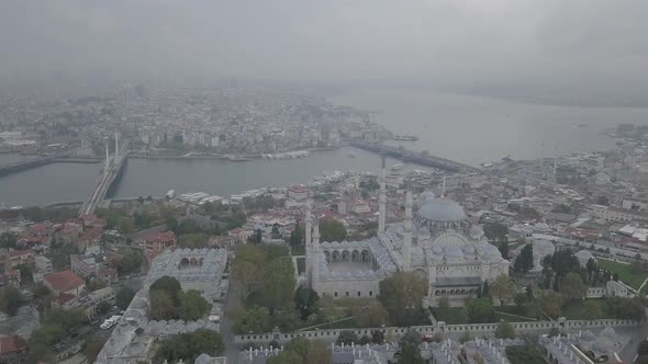 Aerial footage of Suleymaniye Mosque from a foggy day alt