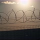Barbed Wire Fence Around the Solar Power Plant During Sunset - VideoHive Item for Sale