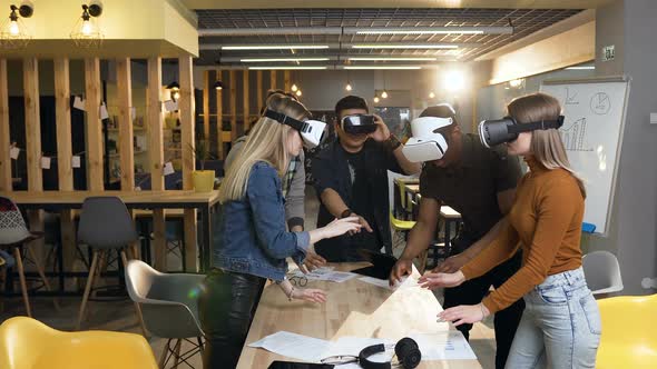 Multi Ethnic Team of Cowoker Working with VR Virtual Reality Glasses in the Modern Office alt