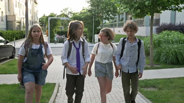 School Friendships. Classmates. Group of Teenagers Returns From School. Friends Are Talking About alt