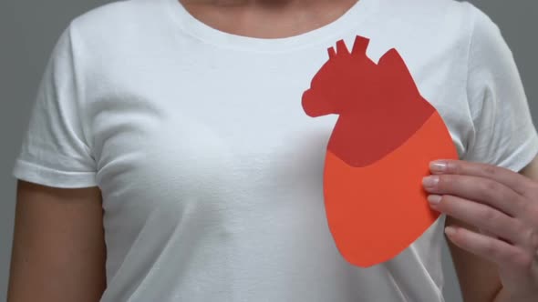 Woman Showing Heart Sign at Camera, Health Care, Blood Problems Prevention