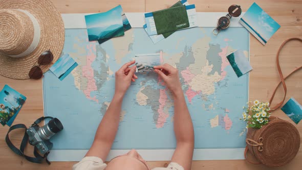 Woman Looking At Pictures Of Landmarks alt