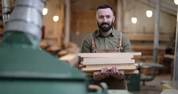 Man Working with Wood at the Joinery alt