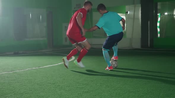 Slow Motion Training Day on the Football Club Young Guys Play Football Indoor Stadium Man Bypass the alt