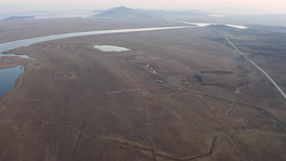 Aerial Footage of a Flock of Whitenecked Cranes at Sunset alt