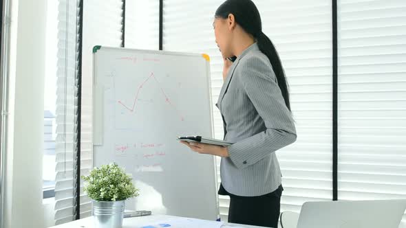 Asian business woman working in office