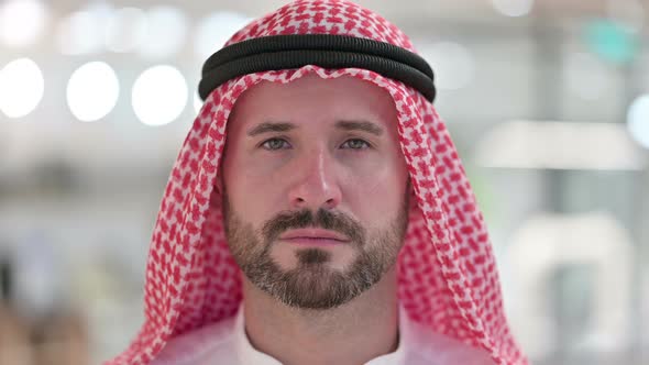 Face Close Up of Serious Arab Man alt