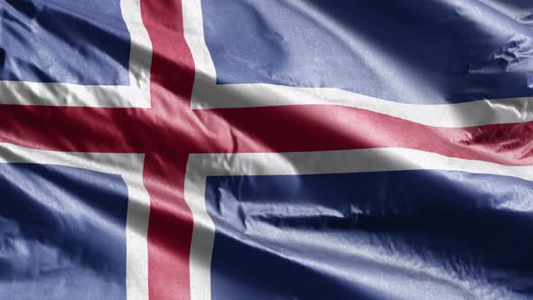 Iceland textile flag waving on the wind. Slow motion. 20 seconds loop.  alt