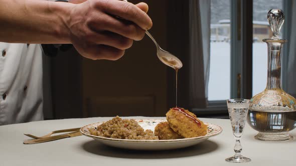Two Fried Cutlets and Bulgur on a Plate alt