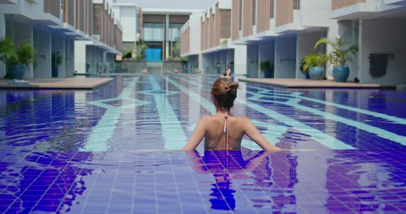 Woman Enjoy Swim at Resort