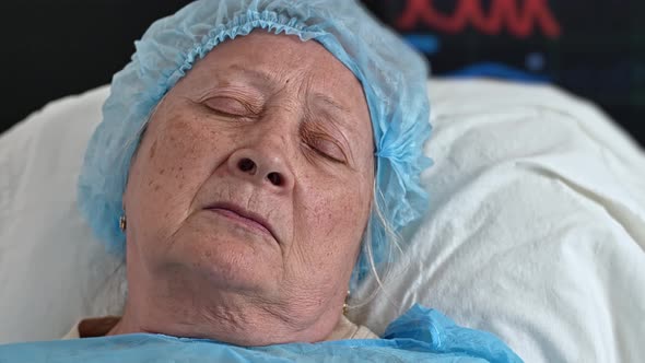 Face of Old Woman Sleeping in Hospital Bed in Hospital alt