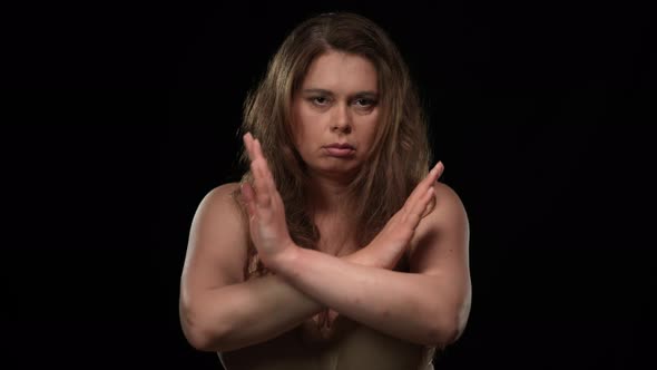 Serious Plus Size Woman Gesturing No Crossing Hands Shaking Head Looking at Camera alt