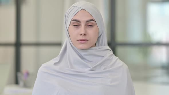 Young Arab Woman Looking at Camera alt