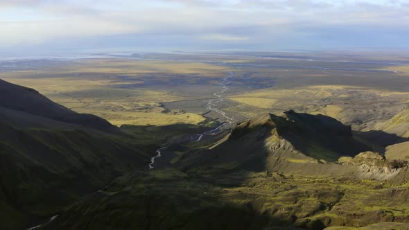 Drone Over Vast Green Landscape With Braided River alt
