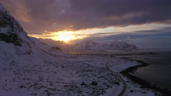 Highway, Sea Shore and Mountains in Winter. Lofoten Islands, Norway. Aerial View alt