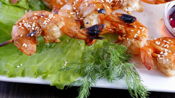 Shrimp Kebabs with Lemon and Sauce  Seafood on a White Plate
