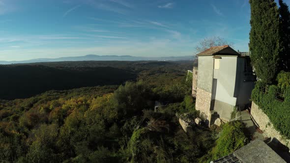 Aerial view of buildings on top of the mountains alt